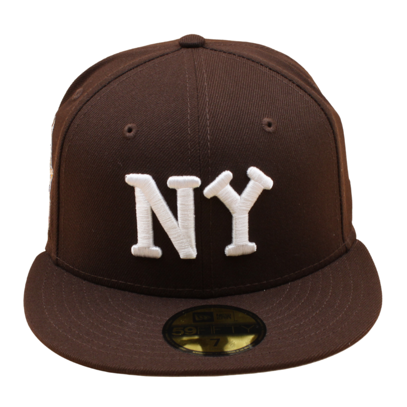 Sort New York Yankees 59FIFTY kasket fra New Era med brunt trædesign, justerbar snapback og klassisk baseballstil.