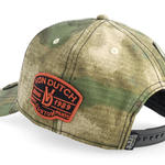 Von Dutch A-Frame kasket med oval patch i grøn camo, klassisk cap design med logo og camouflage mønster.