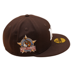 Sort New Era 59FIFTY Yankees-caps med brunt trædesign og New York-logo, synlig på fronten.