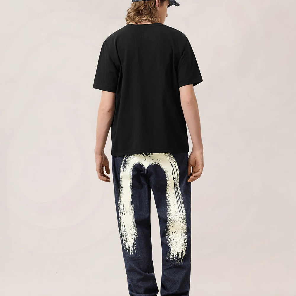 EVISU håndbørste-trykte denim jeans i vaskedindigo, slidstærkt bomuldsstof med unikt design.