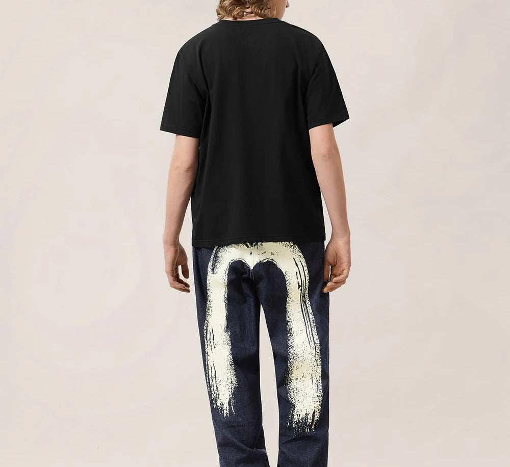 EVISU håndbørste-trykte denim jeans i vaskedindigo, slidstærkt bomuldsstof med unikt design.