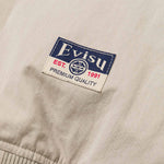 EVISU bomberjakke i grå med Daicock-print, blødt stof og klassisk stil, vises i dette billede.