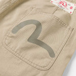 Beige EVISU shorts med fuglemønster vævet design, afslappet stil og komfortabel pasform.