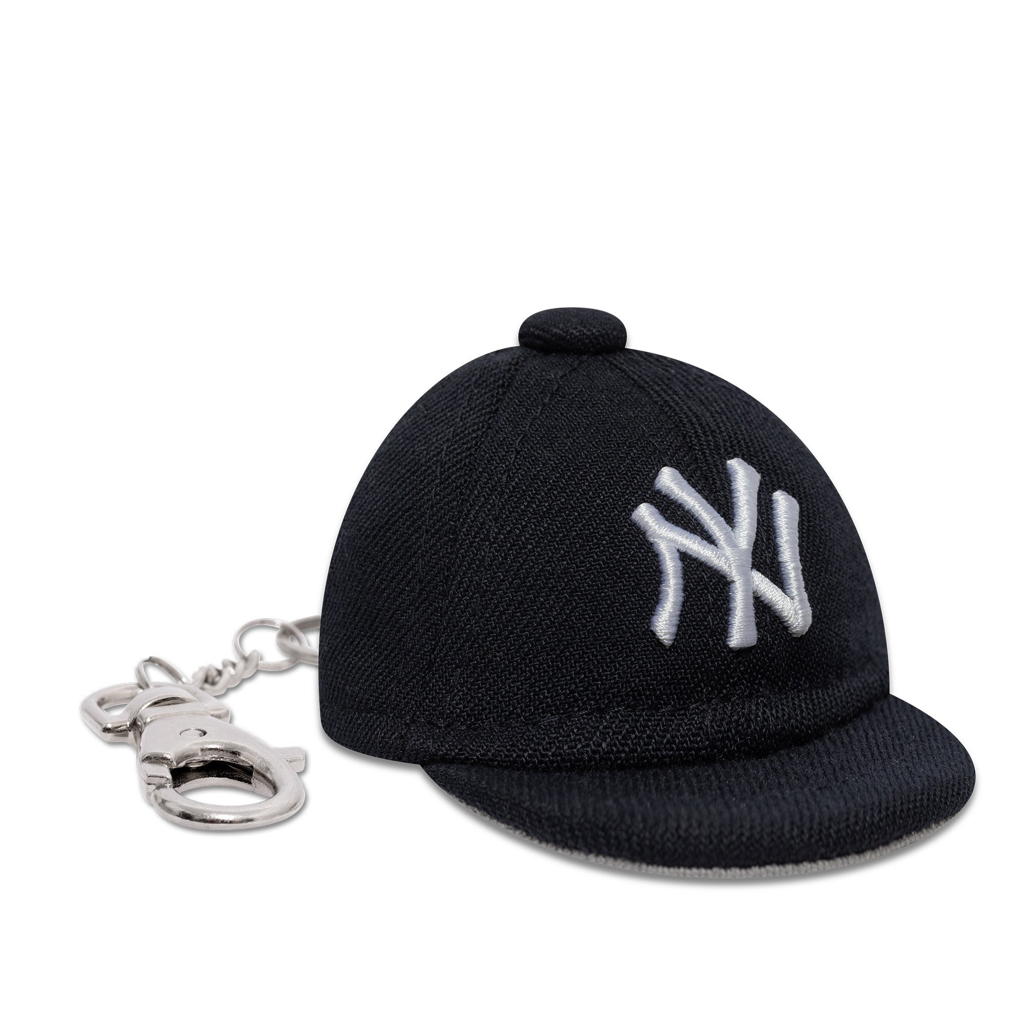 Nøglekæde med mini Yankees baseballkasket fra New Era, sports- og fan-tilbehør, synligt i billedet.