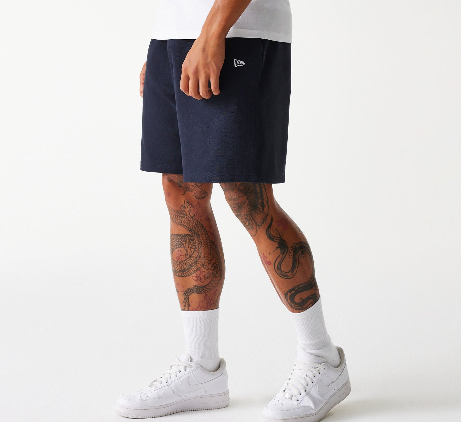 Navy New Era MLB Pique shorts med Yankees logo, afslappet sportstil, fremhævet i billedet.