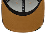 New Era 9FIFTY Trucker Cap i duck camo med netbag og justerbar rem foran, sporty og stilfuld hovedbeklædning