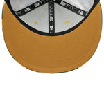 New Era 59FIFTY fitted cap med beige camouflage design og Yankees-logo, perfekt til sport og streetwear.