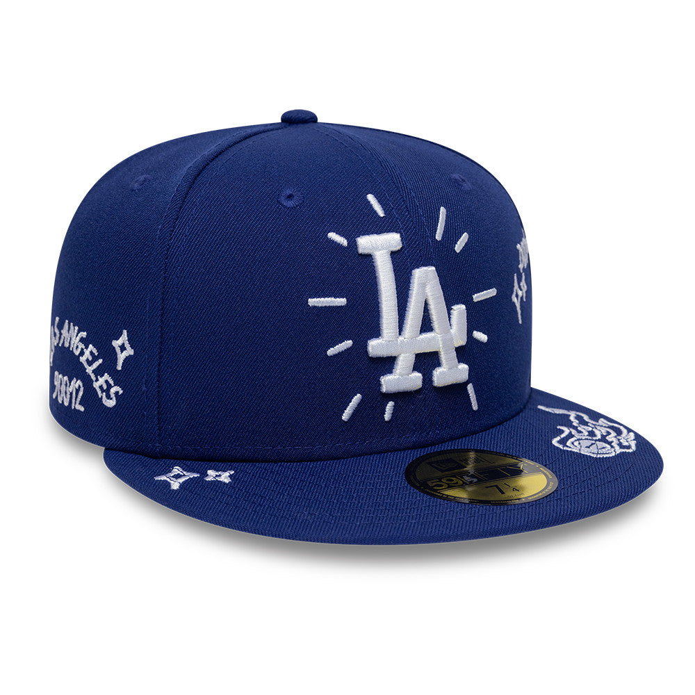 Blå New Era 59FIFTY fitted kasket med Los Angeles Dodgers og scribble-design, synlig foran og på siden.