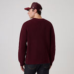 Mørk lilla New Era New York Yankees MLB strikket trøje med waffle-knit tekstur og logo, vises i billedet.