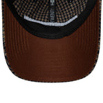 Brun New Era 9TWENTY cap med houndstooth mønster og PSG logo, afslappet og stilfuld hovedbeklædning.