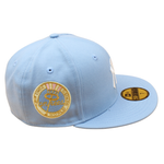 New Era 59FIFTY cap med Yankees logo, Birdseye Blue og Pink UV-mønster, fra World Series 1962 kollektion, stilfuld baseball cap.