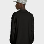 Sort Lau Lau T-shirt med "Loop Waffle LS Tee" print, langærmet casual tøj i blødt materiale.