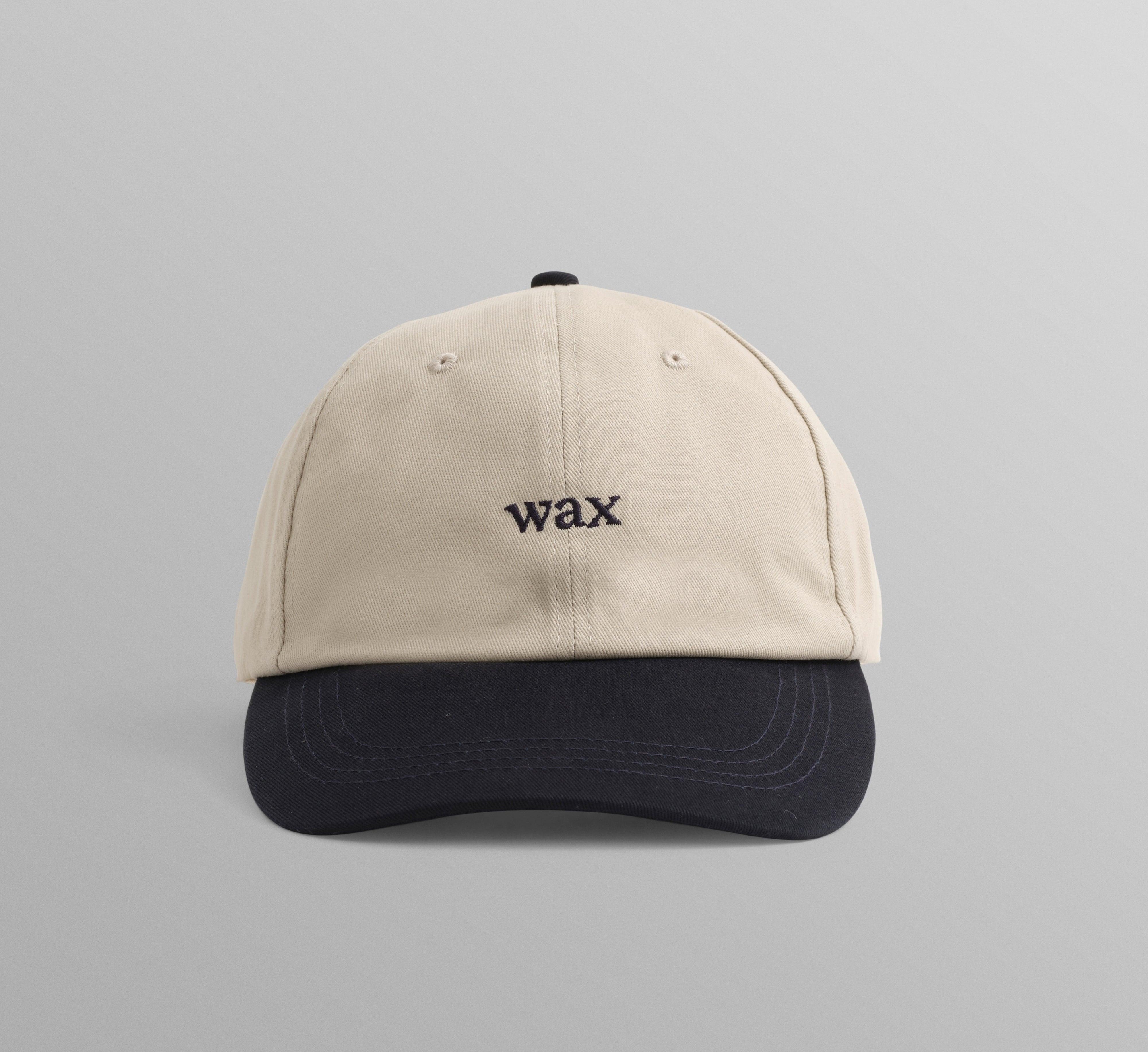 WAX London Spencer sportkasket i stenfarvet og navy bomuld med justerbart bånd og sportslig design.