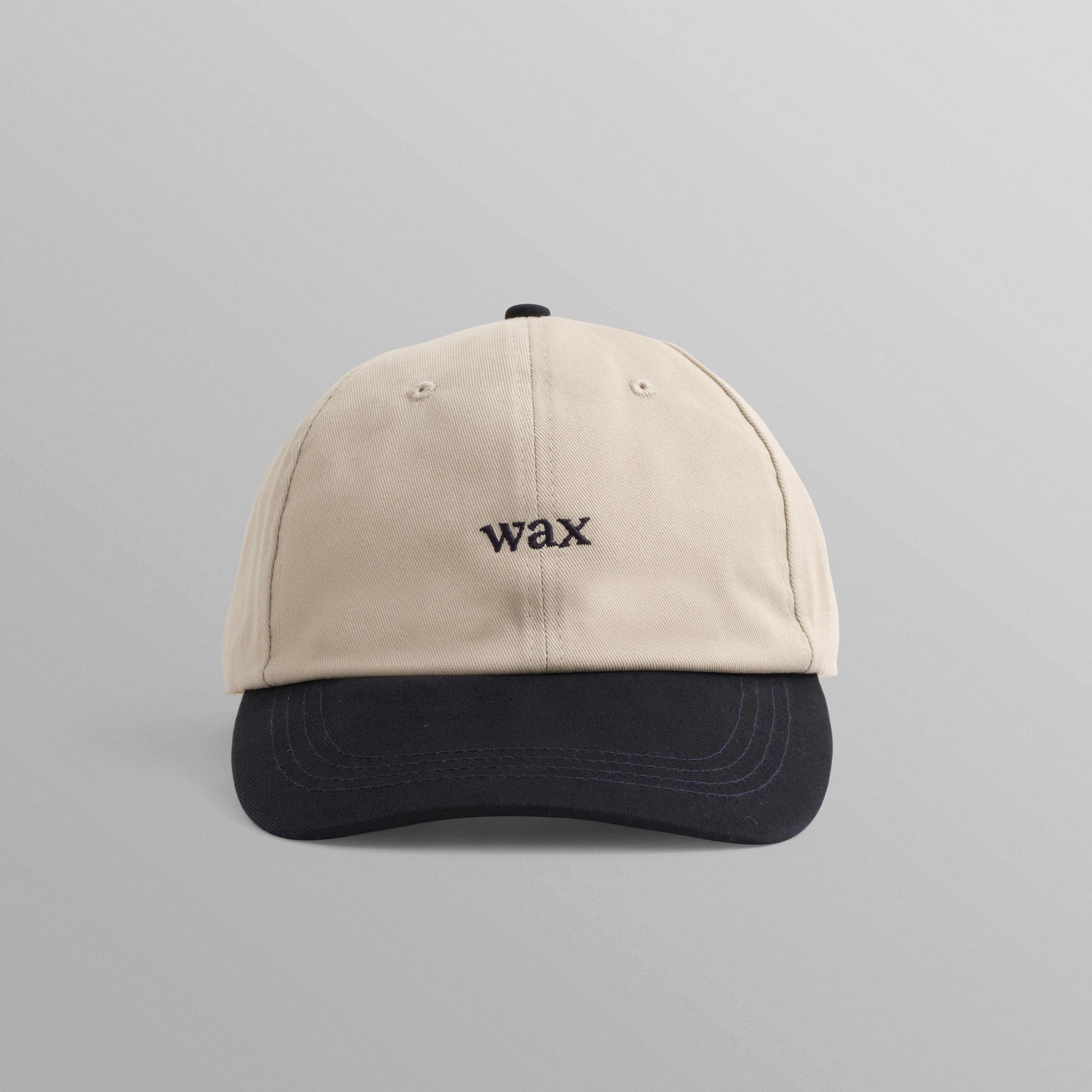 WAX London Spencer sportkasket i stenfarvet og navy bomuld med justerbart bånd og sportslig design.