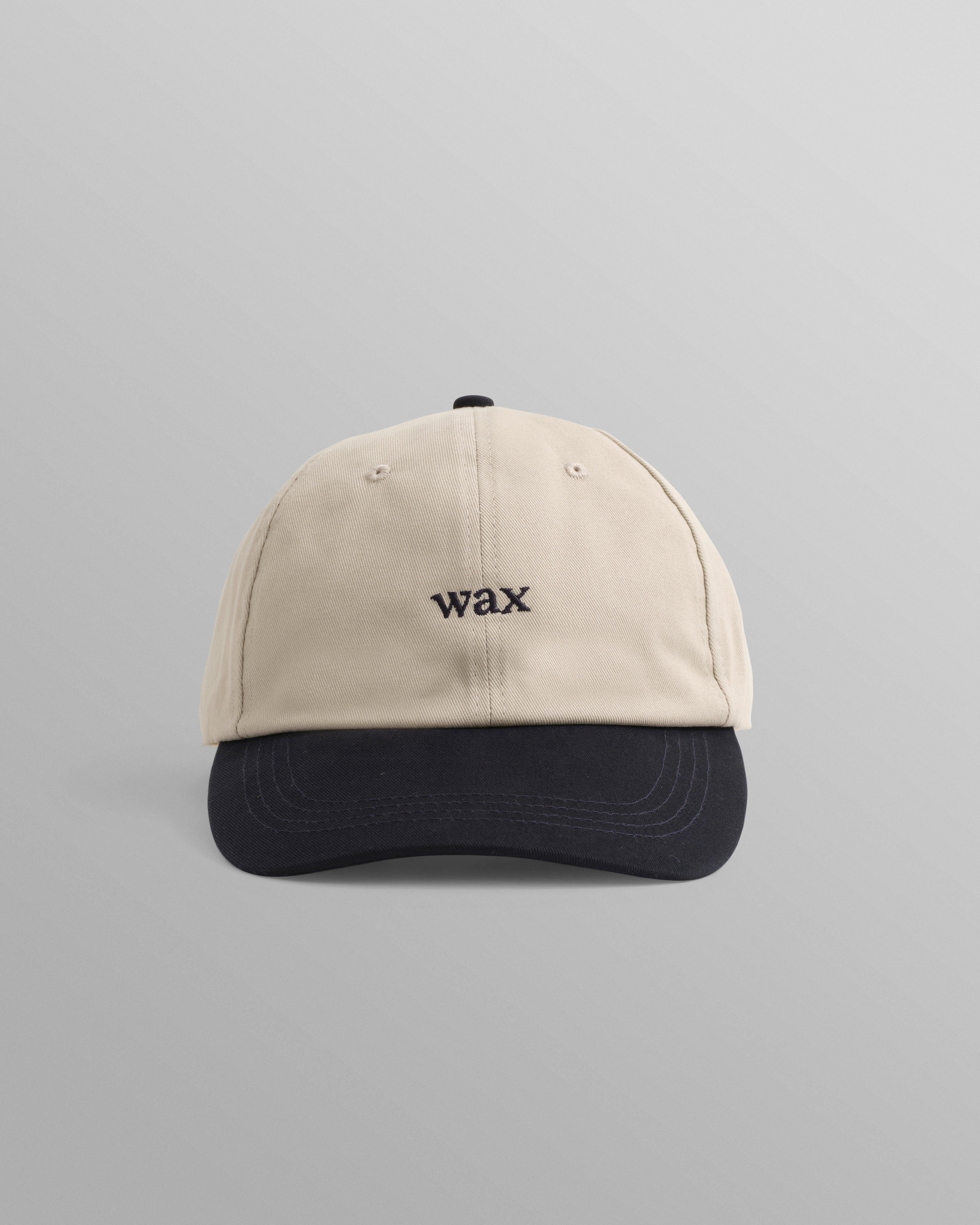 WAX London Spencer sportkasket i stenfarvet og navy bomuld med justerbart bånd og sportslig design.